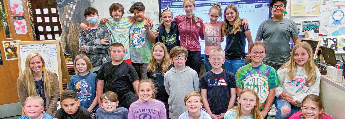 Classroom of students posing for a photo